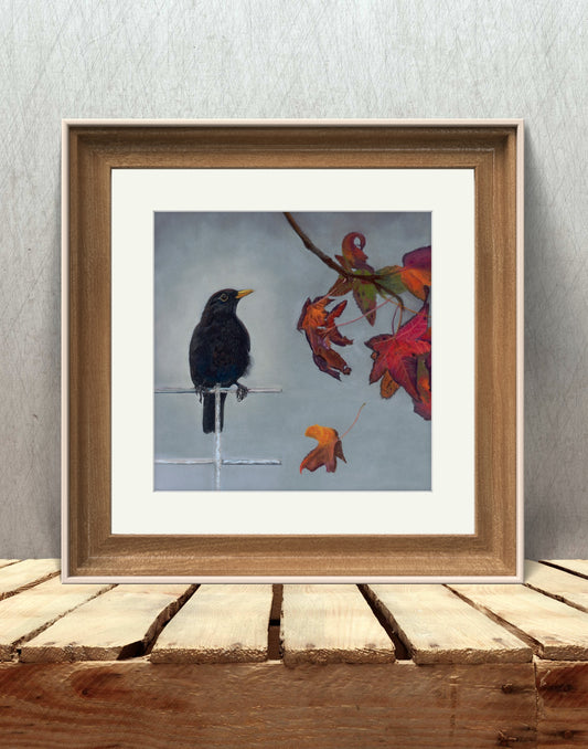 The Autumn Messenger blackbird painting with falling leaves resting on wood
