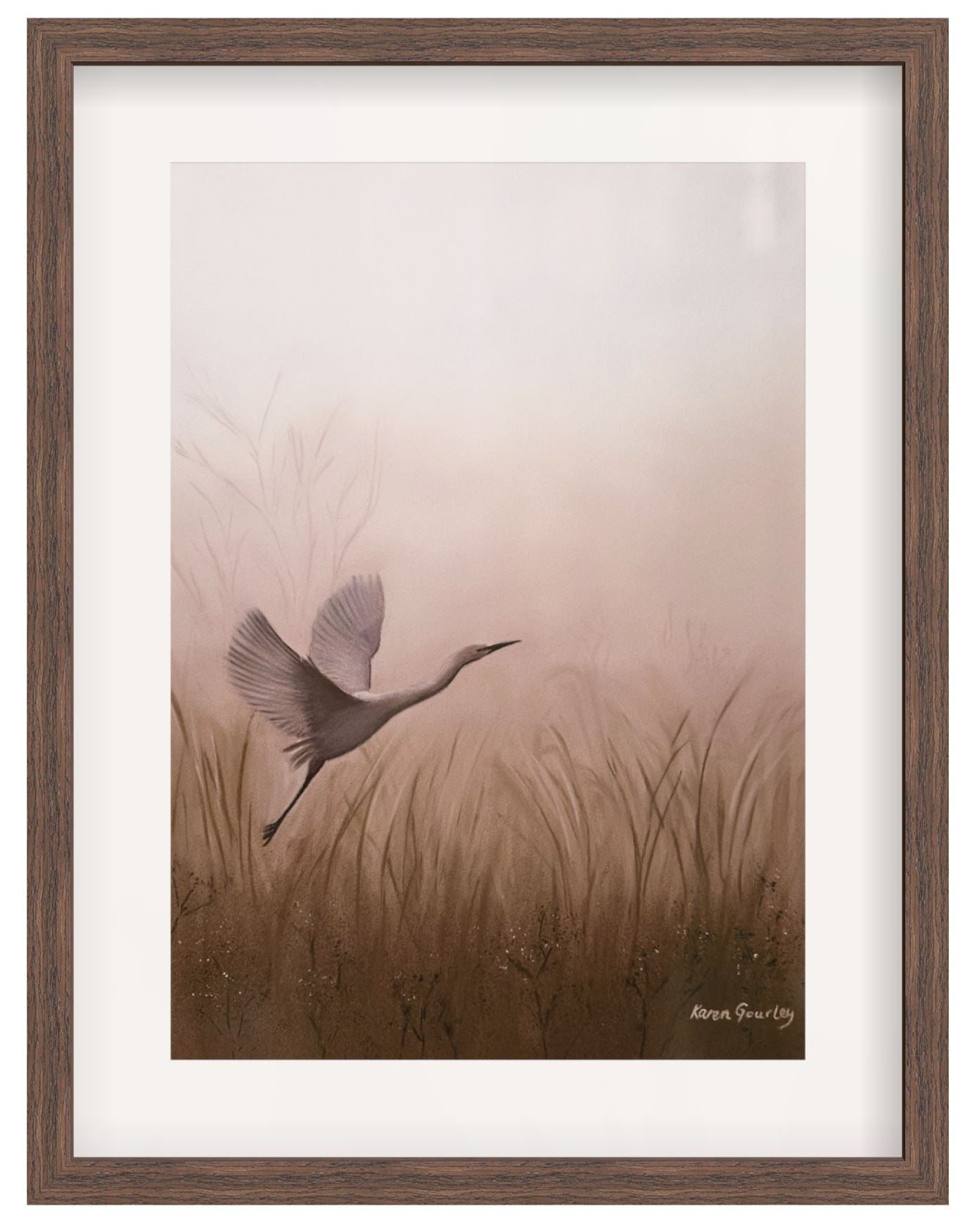Framed artwork of a bird flying over grass with a wooden frame.