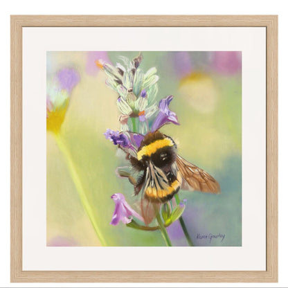 Framed artwork of a bee on a flower with a blurred background