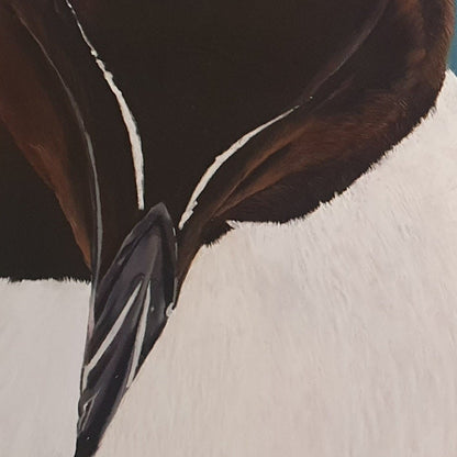 Close-up of a bird with brown and white feathers against a blue background
