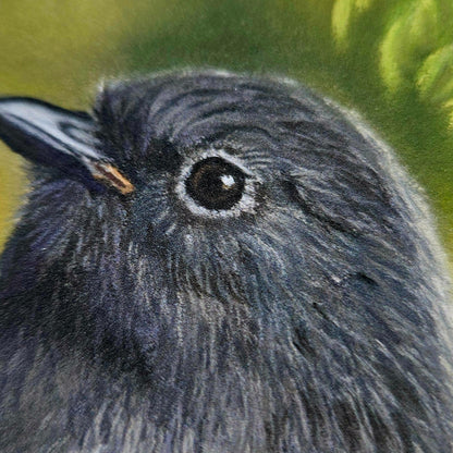 Close-up of the South Island robin’s eye and feather detail in The Forest Watches Back print by Karen Gourley